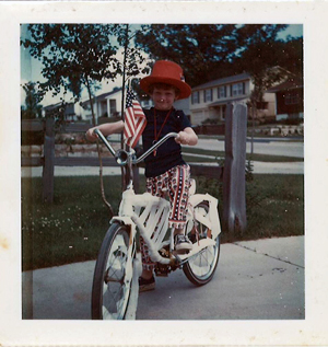 Seattle bicycle attorney Bob Anderton pictured on his bicycle as a young boy on 4th of July.